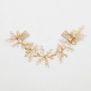 Golden bridal hair comb with elegant metallic leaves and delicate white pearls
