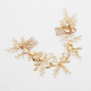 Golden bridal hair comb with pearls and leaf vine design for weddings and formal events