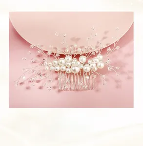Detailed close-up of handmade bridal hair comb with white pearls and clear crystals