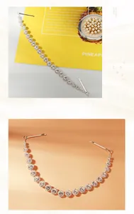 Close-up of silver hair chain featuring sparkling white rhinestones and secure clips