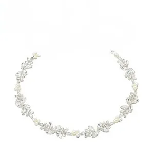 Detail of silver bridal headband with marquise rhinestones, pearls and white silk ribbons