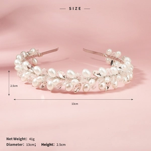 Macro detail of handmade bridal headband with white pearls and sparkling crystals