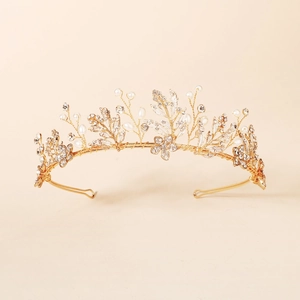 Vintage gold bridal headband with floral metal leaves, white pearls and sparkling rhinestones