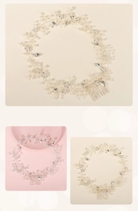 Close-up of handmade bridal hair comb with silver wire, white pearls and crystals