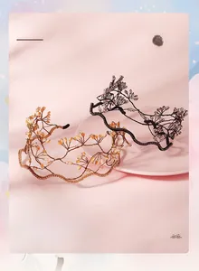 Detail showing crystal woven bridal headbands in gold and black with branch-like designs
