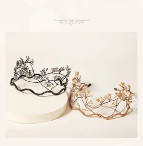Detail shot of handcrafted crystal beaded branch headbands in black and amber tones