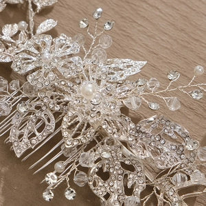 Silver bridal hair comb with elegant crystal flowers, pearls and leaf details