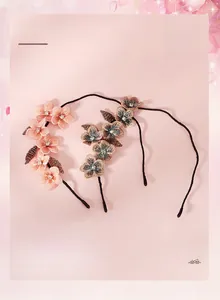 Detail of handcrafted French style headbands with 3D floral embroidery and sparkling crystals