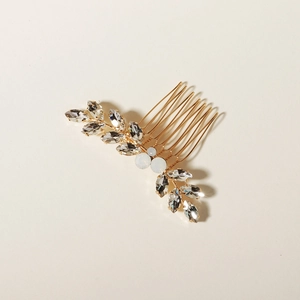 Eleganter goldener Haarkamm mit Blättern und Strasssteinen für Brautfrisuren bei Hochzeiten