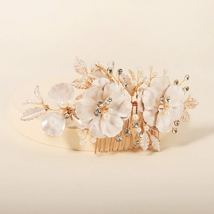 Floral bridal hair comb with white flowers, gold leaves, pearls and crystals