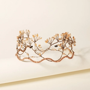 Elegant rose gold branch bridal crown with amber beads and sparkling crystals for weddings