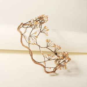 Elegant bridal headband featuring handmade gold wire branches with peach crystal beads
