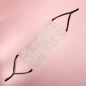 Detail of sparkly silver rhinestone mesh face mask with adjustable black ear loops