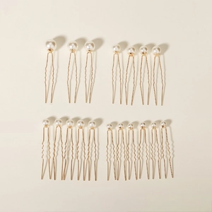 Set of 18 golden U-shaped hair pins with elegant white pearls for bridal hairstyles