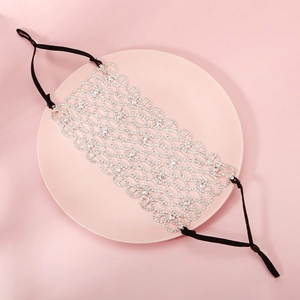 Detail of luxury rhinestone mesh mask with adjustable straps for parties and events