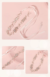 Detail of silver bridal headband featuring handmade pearls, rhinestones and ribbon