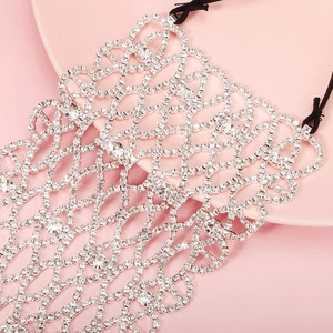 Detail of silver rhinestone mesh mask with wave pattern and elastic strap for party