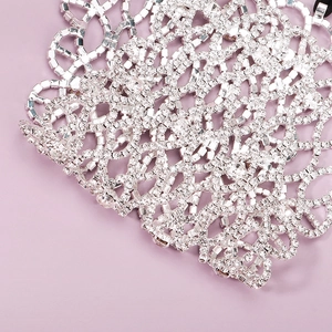 Detailed view of silver mesh mask with sparkling rhinestones for party accessories