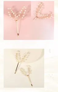 Detailed macro view of handmade pearl hair clip with wire-wrapped tree branch design