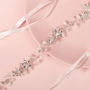 Elegant bridal hairband with crystal flowers, pearls and pink silk ribbons