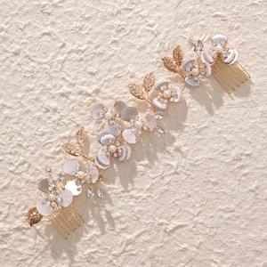Elegant floral bridal hair comb with purple petals, pearls and crystals for wedding hairstyles