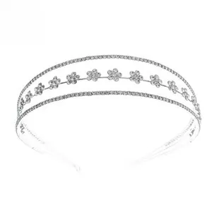 Detailed macro view of triple-layer silver headband with sparkling zircon flower patterns