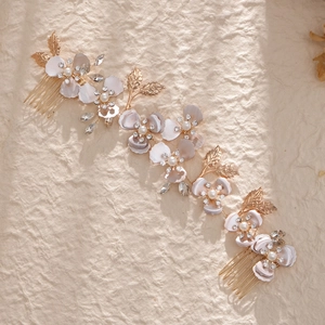 Handmade gold floral bridal hair comb with pearls and leaves for wedding hair styling