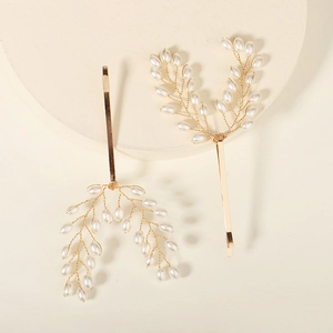 Elegant gold pearl barrette clips in a leaf design with a French vintage style look