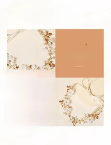 Detailed close-up of handmade white daisy hairband with pearls and golden leaves