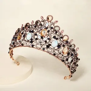 Detail of baroque alloy crown with multicolored rhinestones and opal stones for weddings