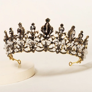 Macro detail of Baroque bridal crown with gold alloy base and grey crystal rhinestones