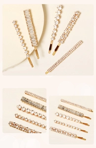 Détail d'un lot de 5 barrettes dorées avec des strass étincelants et des cristaux
