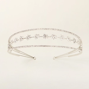 Elegant silver bridal tiara with three layers of sparkling crystals and floral motifs