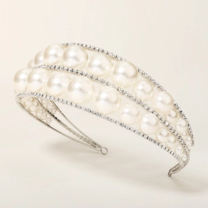 Elegant silver bridal headband with multiple layers of white pearls and sparkling rhinestones