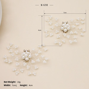 Detail showing bridal pearl shoe clip dimensions of 7cm by 4cm for elegant wedding footwear