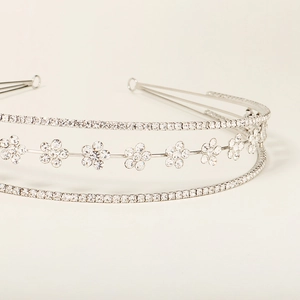 Sparkling silver rhinestone crown headband with intricate floral hollow design for weddings