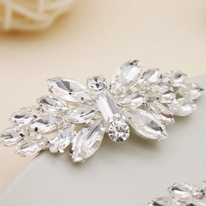 Detailed macro view of silver rhinestone shoe clip with sparkling crystal flower cluster