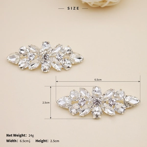 Detail view showing detachable silver shoe clips with sparkling marquise and pear-cut rhinestones