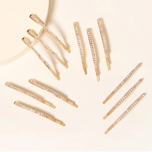 Detailliertes Set mit 12 goldenen Strass-Haarklammern in einer eleganten Anordnung