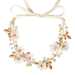 Floral bridal headband with white flowers, gold leaves, pearls, and a beige satin ribbon