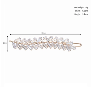 Detailed view of leaf-shaped rhinestone hair clip with dimensions 6.6cm by 1.2cm