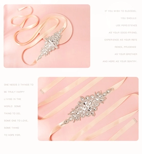 Detail of luxury rhinestone bridal belt with champagne satin ribbon and marquise crystals