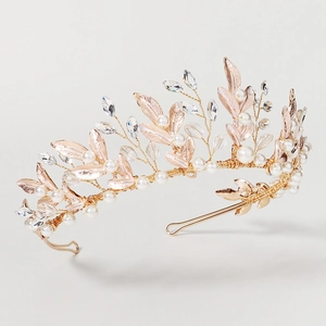 Detailed view of handmade rose gold bridal tiara with pearls and crystal floral accents