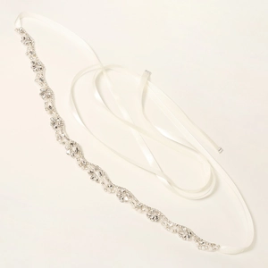 Detail of silver bridal sash with marquise rhinestones and pearls on white satin ribbon