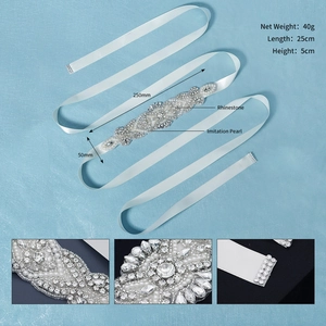 Detailed close-up showing 25cm hand-sewn rhinestones and pearls on bridal belt sash