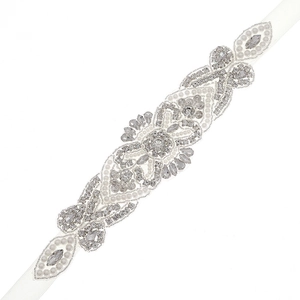 Exquisite bridal sash with hand-sewn rhinestones and pearls on a white satin ribbon