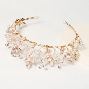 Handmade bridal crown with gold leaf accents, pearls, and crystals in romantic vine style