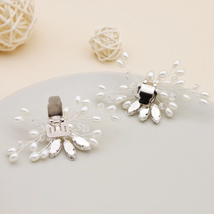 Elegant bridal shoe clips featuring faux pearls and sparkling crystals in floral design