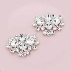 Detailed close-up of sparkling floral rhinestone shoe clips for bridal and evening footwear