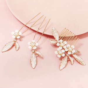Elegant bridal hair accessory set with gold leaves, white flowers, and pearls for weddings